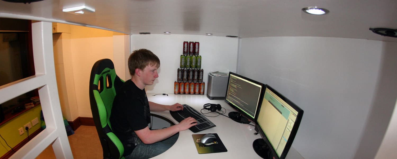 Joel Vardy working at desk in 2009